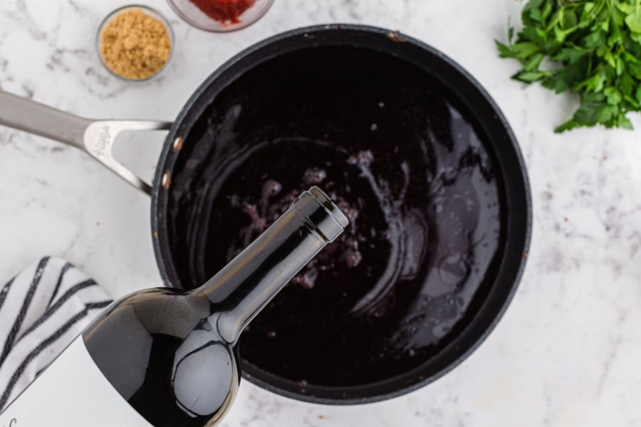 pouring wine into pan