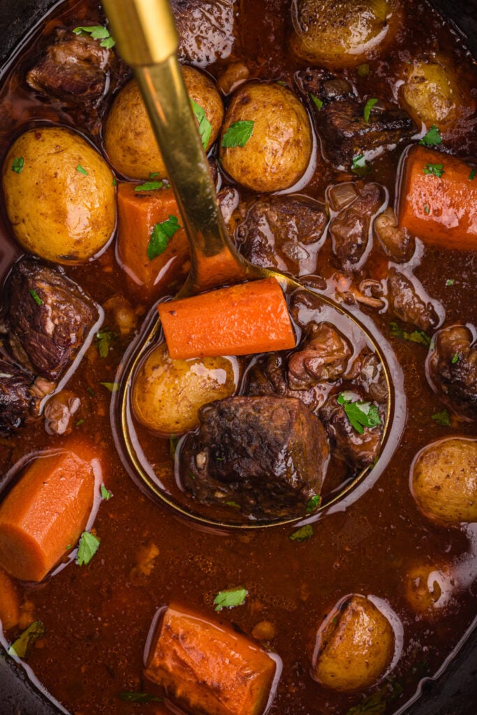 ladle scooping up Crockpot Beef Bourguignon