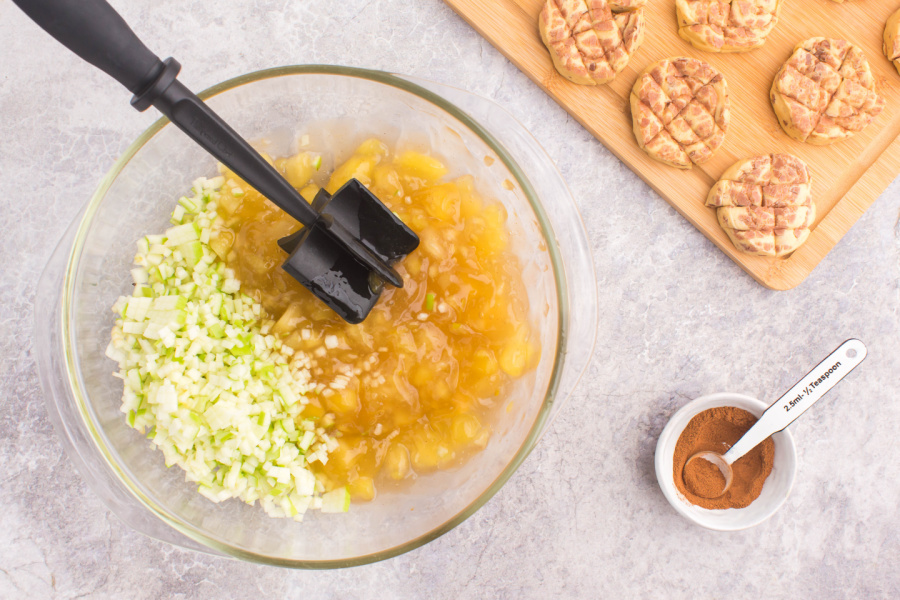 diced apples and apple pie filling in a mixing bowl