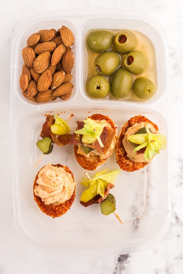 Bloody Mary deviled eggs packed in a lunchbox