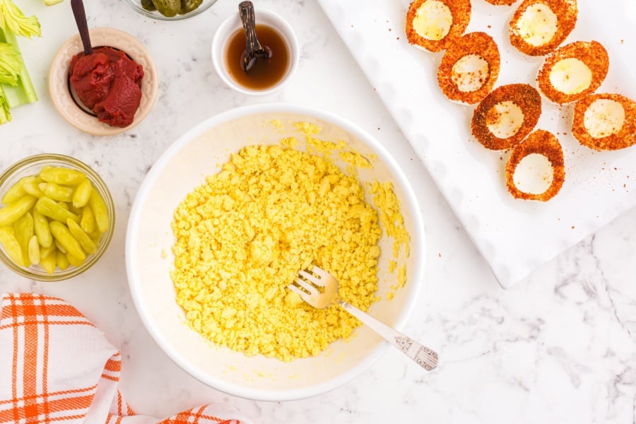 egg yolks mashed in a bowl