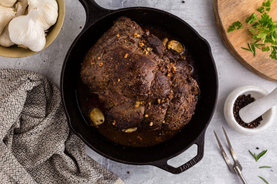 Cooked beef tenderloin in cast iron pan