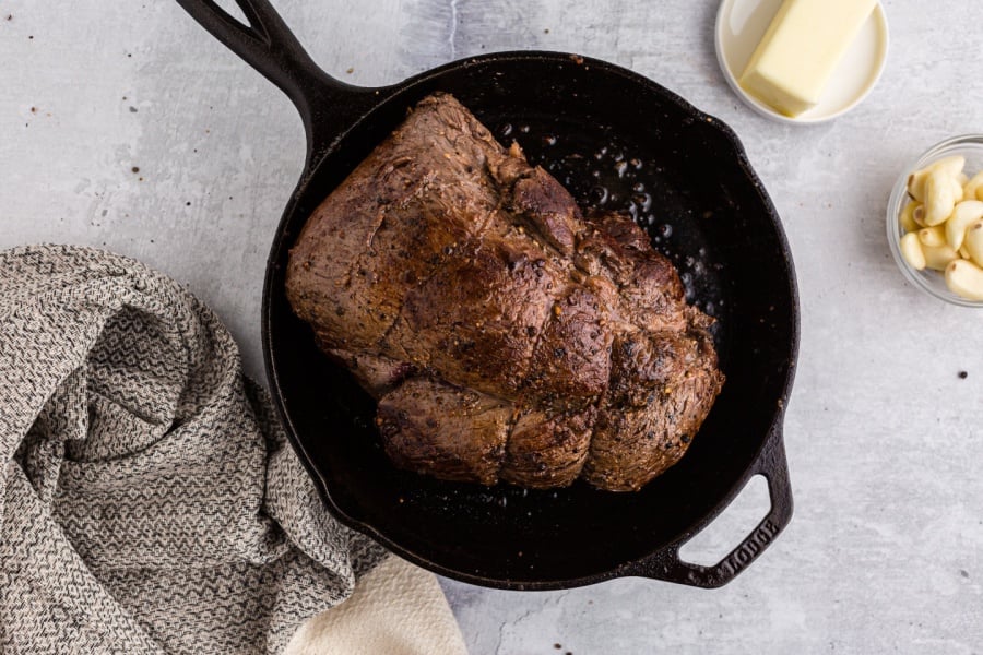 beef tenderloin tired up and seasoned with pepper