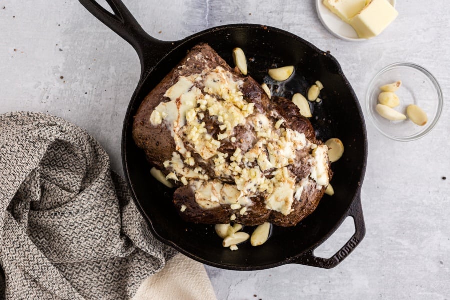 butter and garlic spread on beef tenderloin