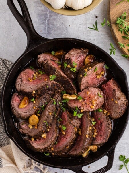 Garlic Roasted Beef Tenderloin Recipe in a cast iron pan