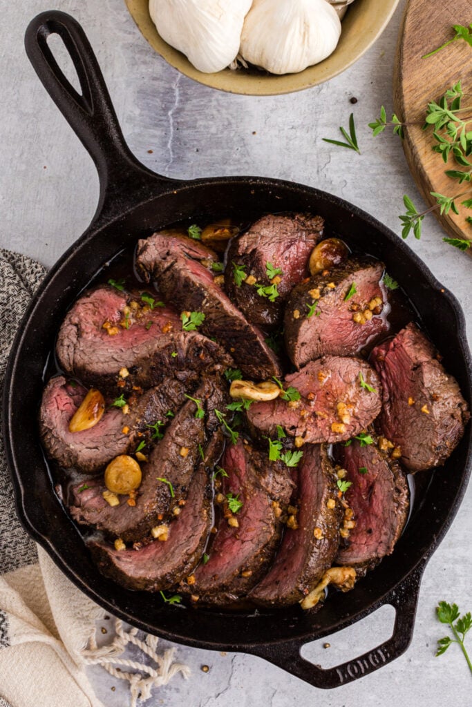 Garlic Roasted Beef Tenderloin Recipe in a cast iron pan