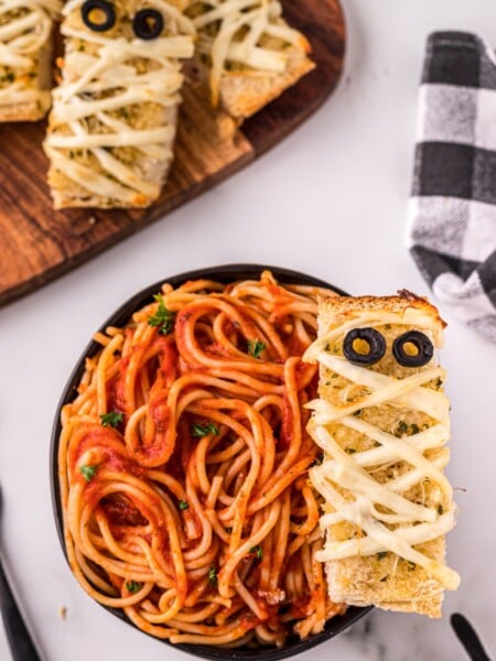 Mummy garlic bread in a bowl of spaghetti