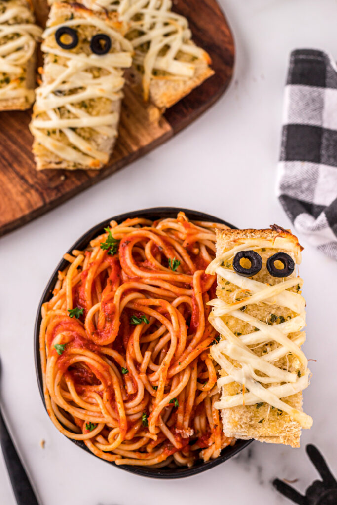 Mummy garlic bread in a bowl of spaghetti
