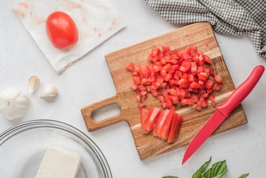 diced tomatoes on a cutting board