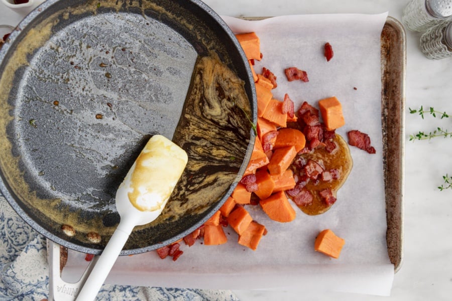 pouring sauce over yams and bacon