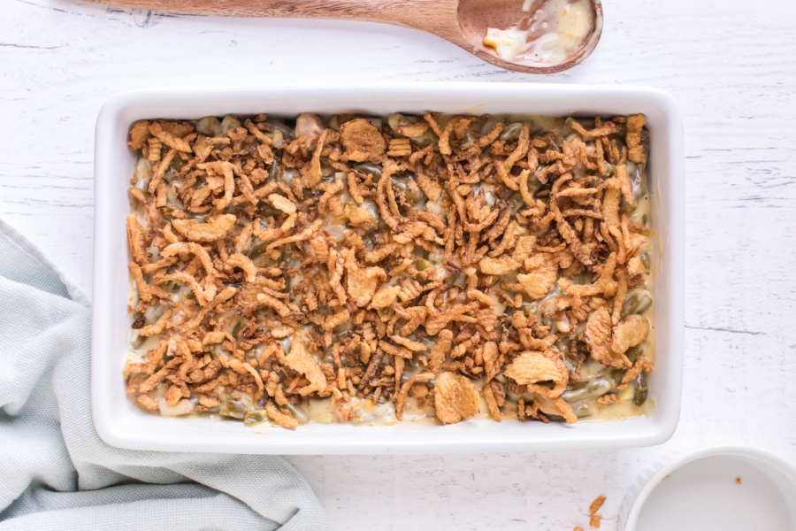 adding fried onions on top of casserole