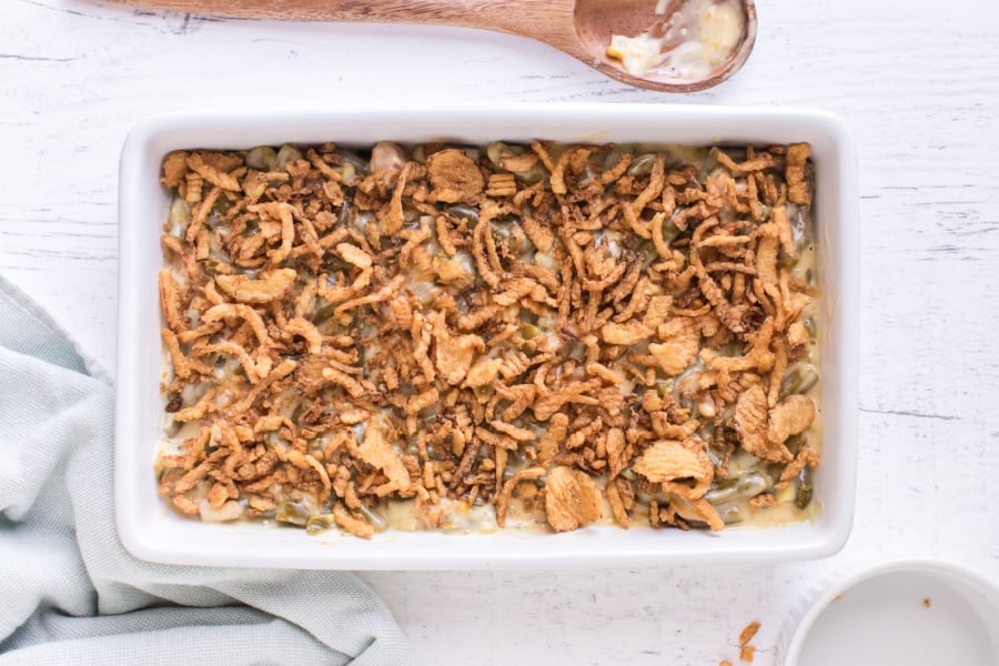 adding fried onions on top of casserole