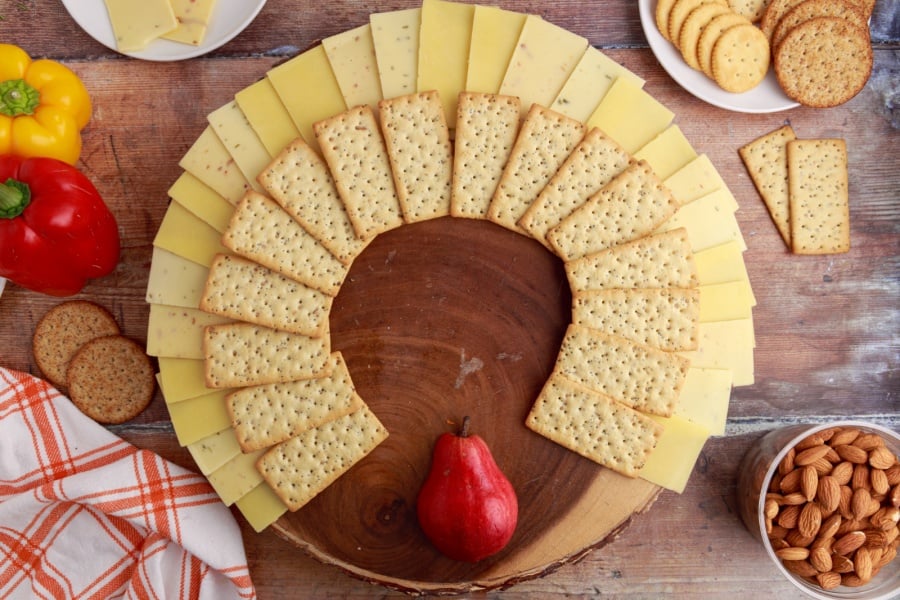 adding rectangle crackers under cheese slices