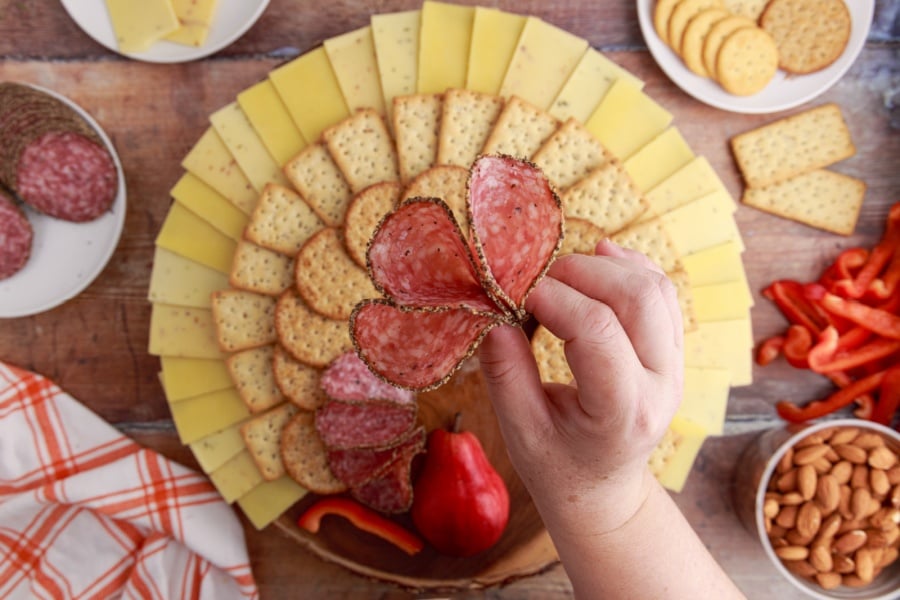 showing how to pinch salami together