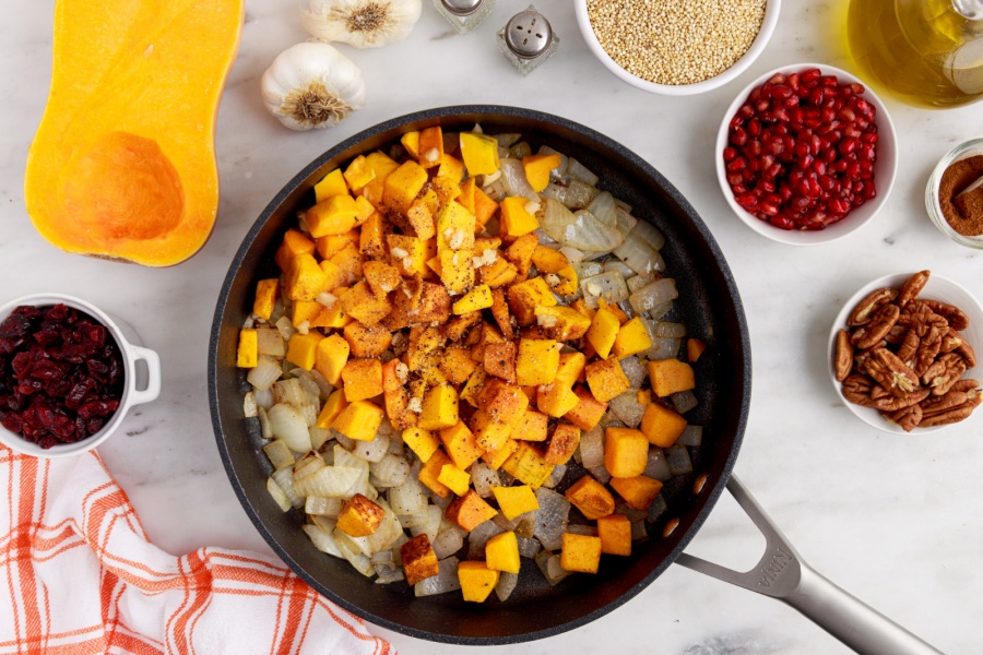 cubed squash added into pan