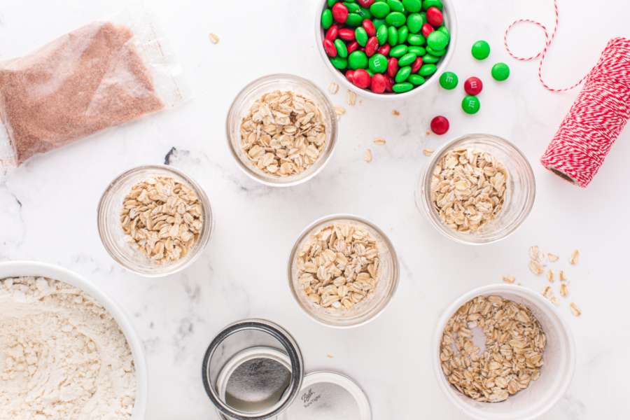 adding rolled oats to jars