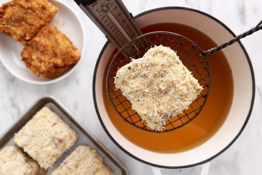 coated lasagna in a spoon basket