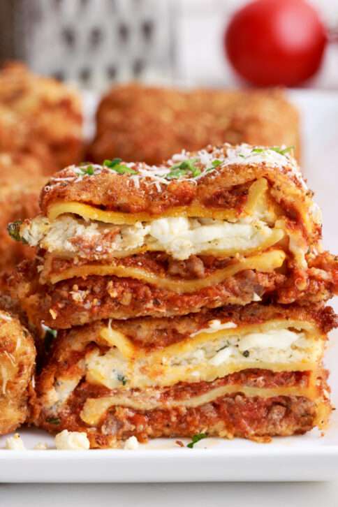 Deep Fried Lasagna pieces stacked on a plate