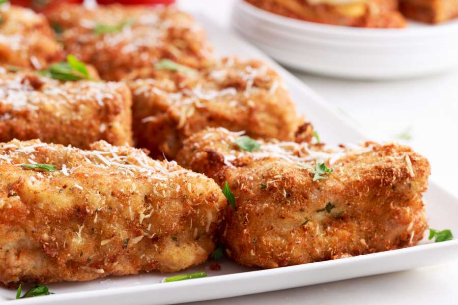 deep fried lasagna pieces on a plate