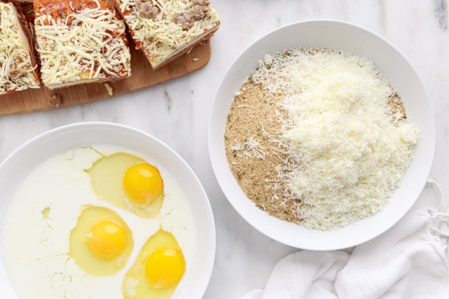 bowl of eggs and milk and a bowl of bread crumb mixture