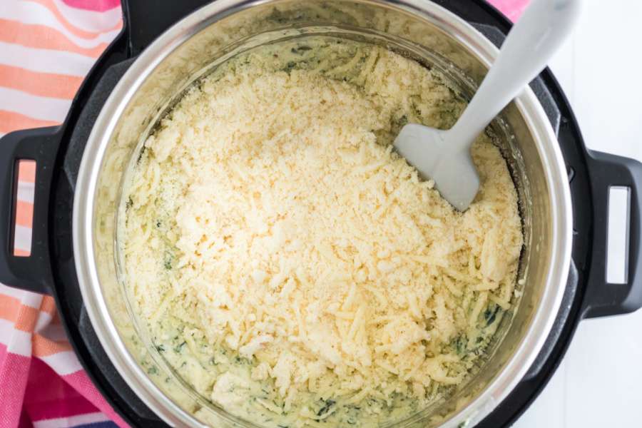 adding in shredded cheese to sip