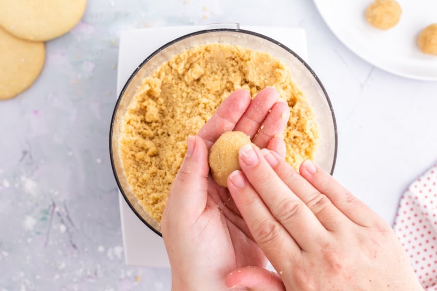 rolling cookie balls with hands