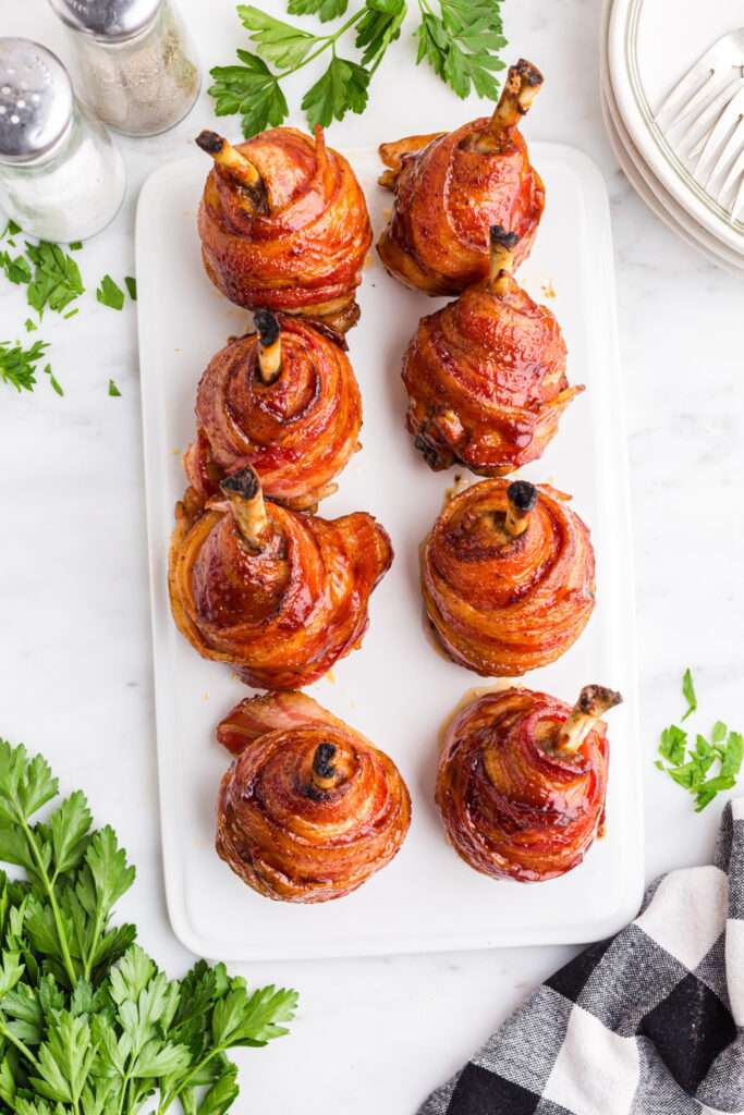 Bacon Wrapped Chicken Lollipops on a plate