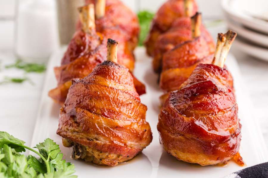 Bacon Wrapped Chicken Lollipops on a plate