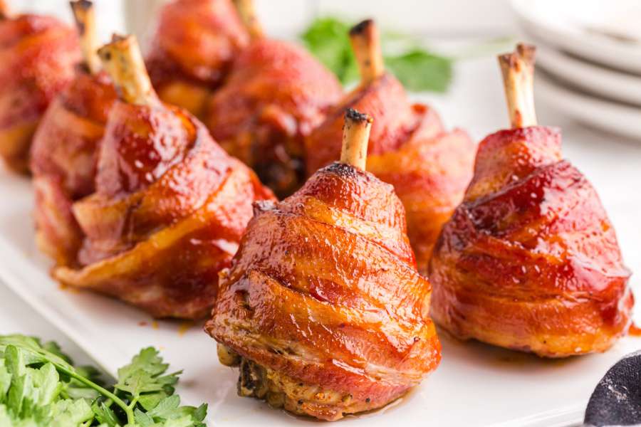 Bacon Wrapped Chicken Lollipops on a plate