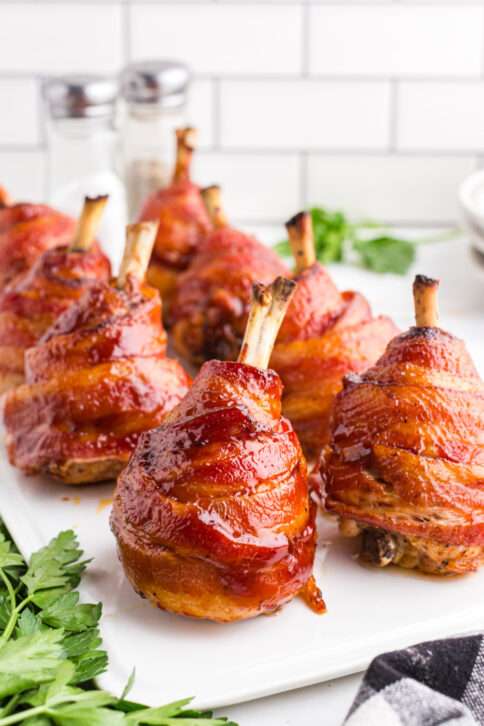 Bacon Wrapped Chicken Lollipops on a plate