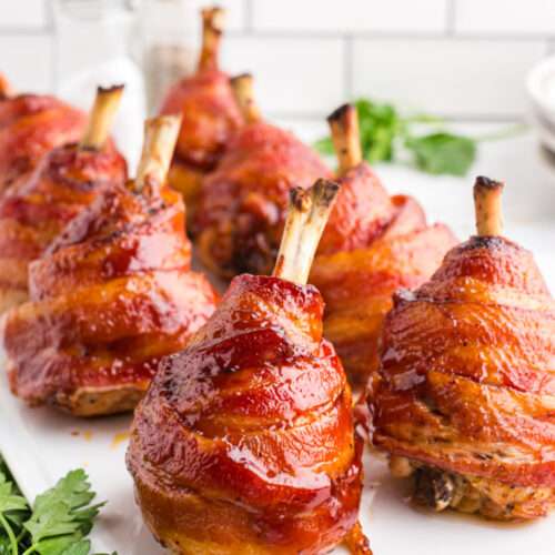 Bacon Wrapped Chicken Lollipops on a plate