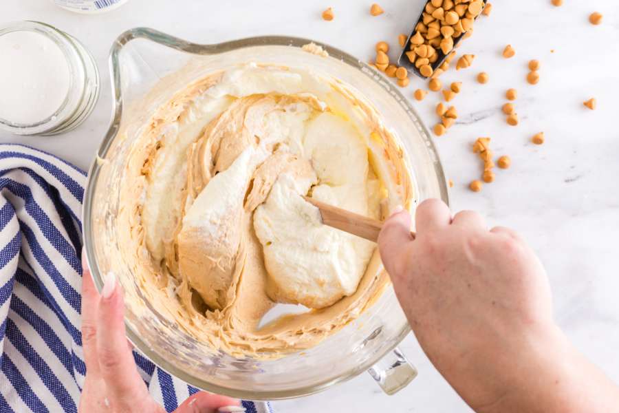 folding whipped cream into peanut butter mixture