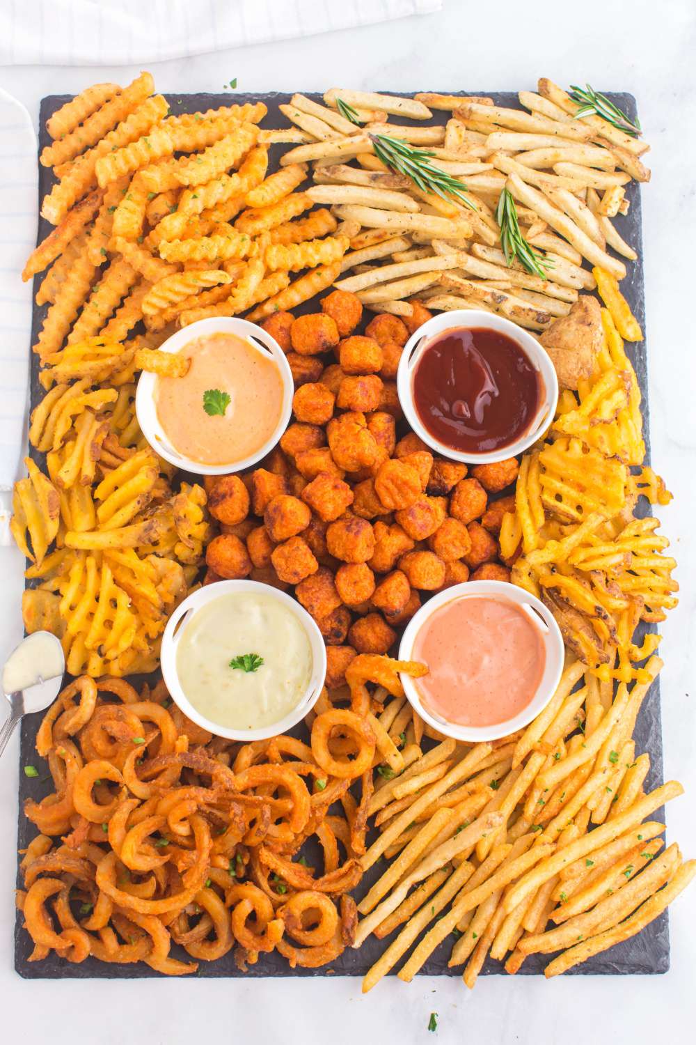 This French Fry Appetizer Board is so fun and you can make it however you wish! Pick your favorite fries, tots, or onion rings to add your own spin on it. via @familyfresh