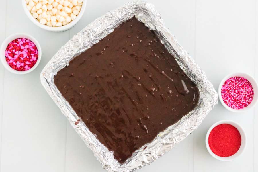 brownie batter in a prepared pan