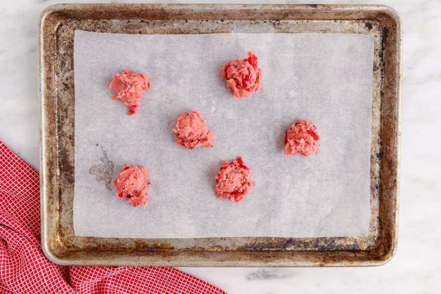 cookie dough balls on a cooking sheet