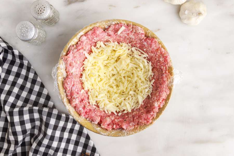 shredded cheese added into meat bowl