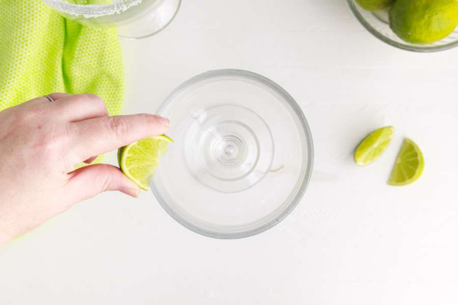 rubbing lime on rim of glass