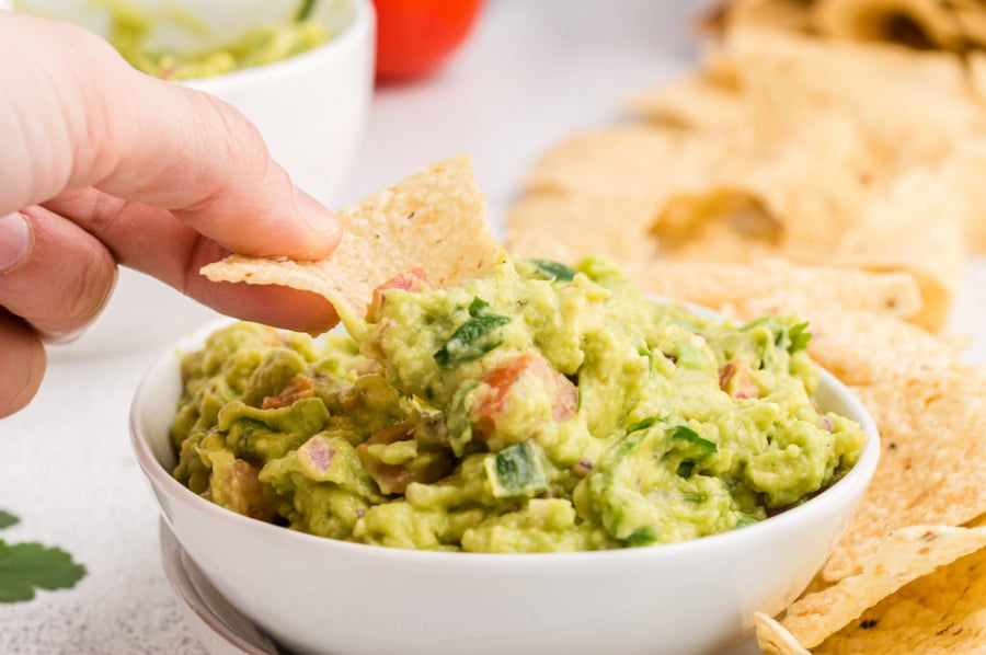 chip scooping up some guacamole