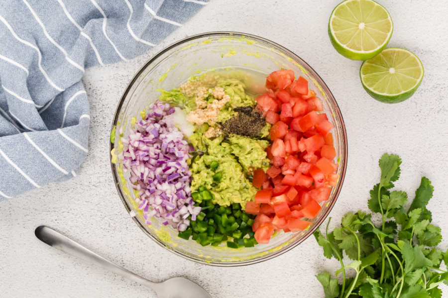 jalapeno, tomatoes, onion and seasoning added to mixing bowl