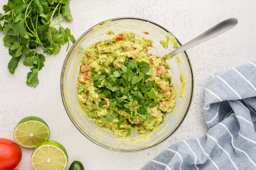 adding cilantro to bowl