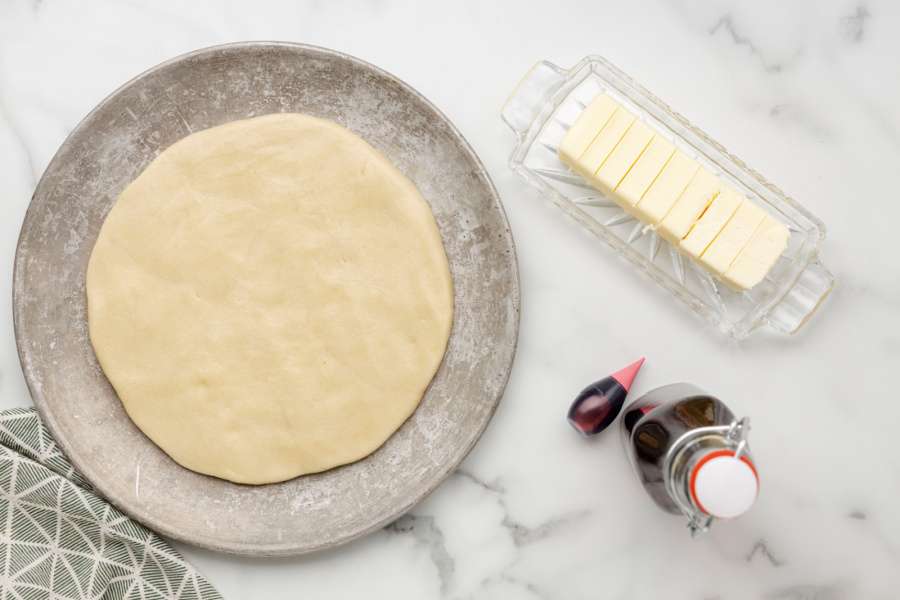 cookie dough formed into a large circle on pan