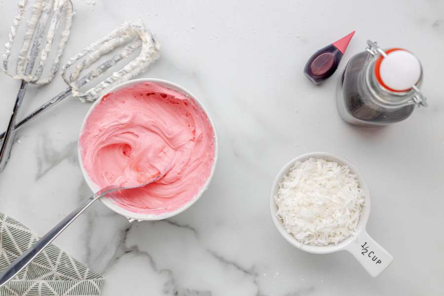 pink frosting in a small bowl