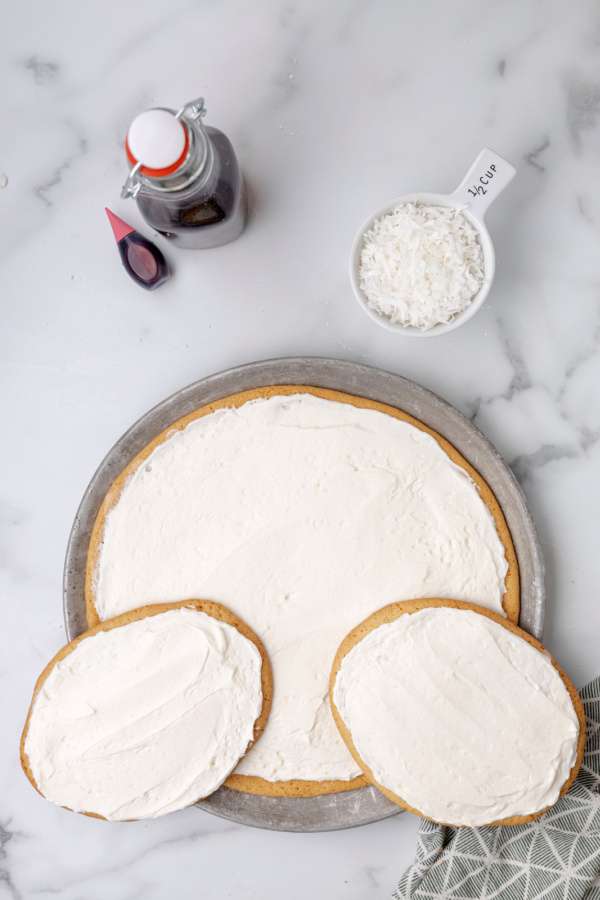 frosting added to tops of cake and bunny feet