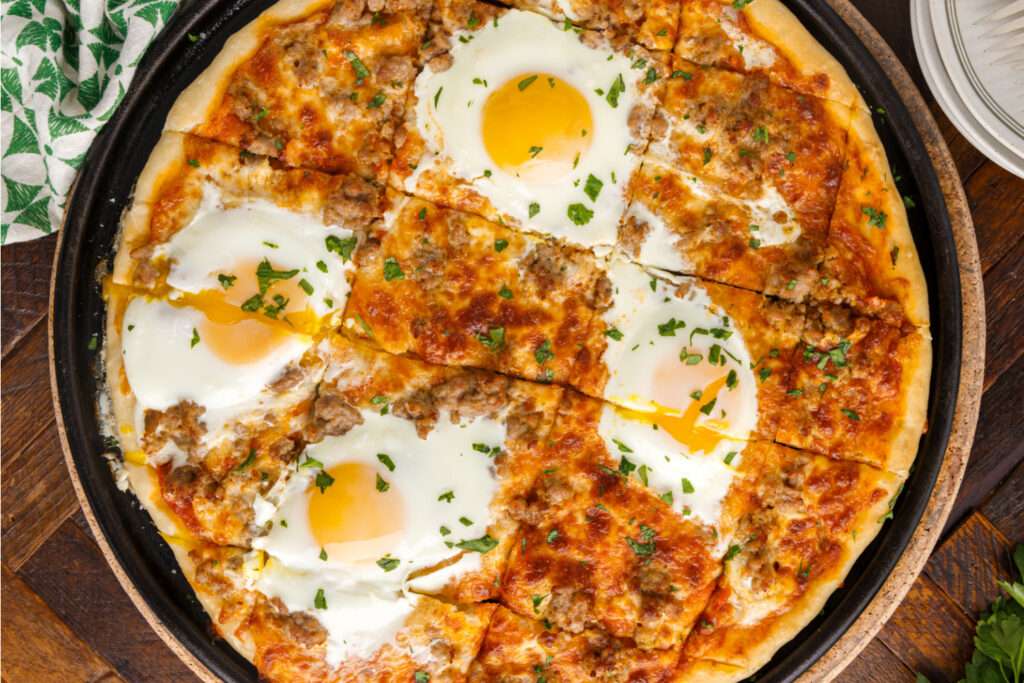 breakfast pizza cut into slices