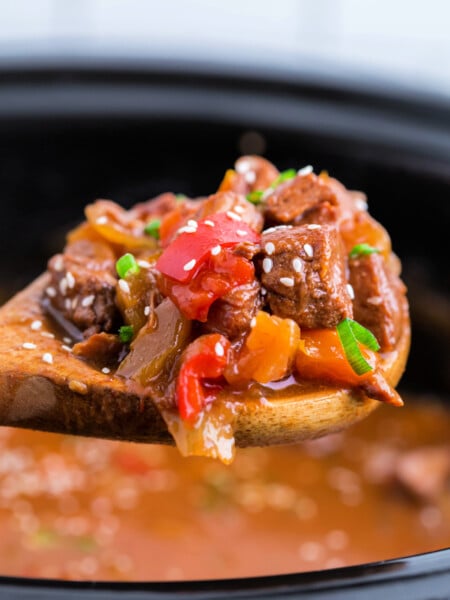 spoon scooping up some Crockpot Sweet and Sour Pork