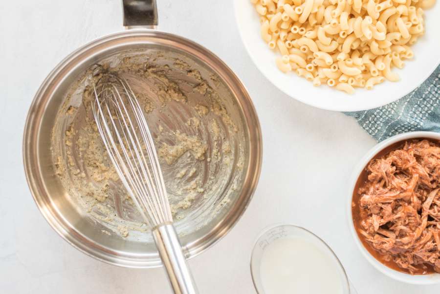 mixing butter garlic and seasoning in pan