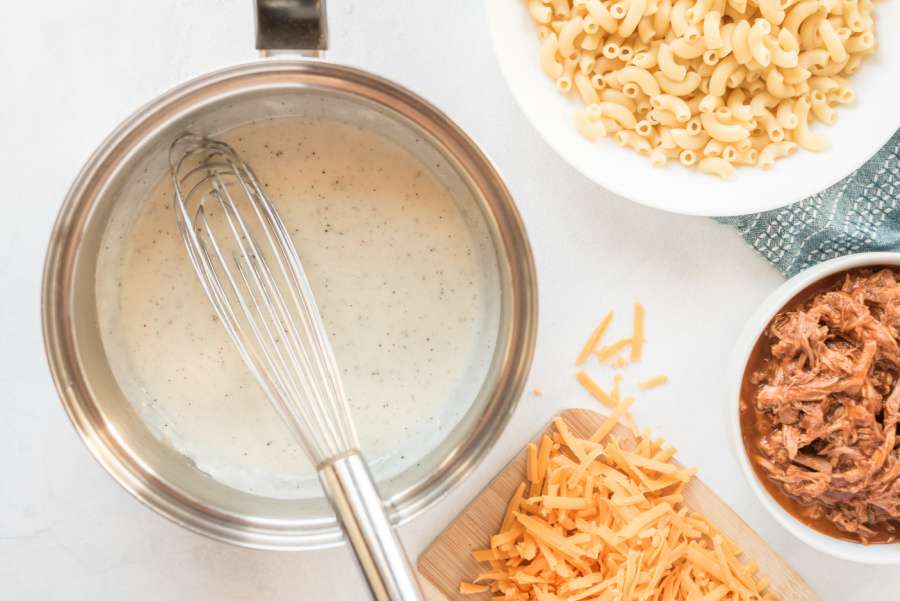 adding milk to the pan