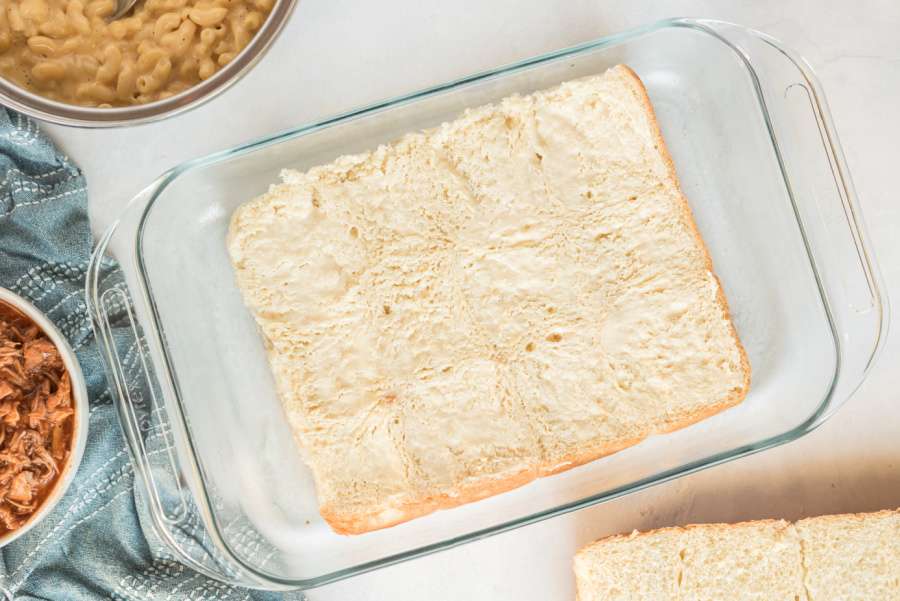 bottom of buns placed in pan with butter