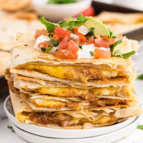 Sheet Pan Quesadillas stacked on a plate