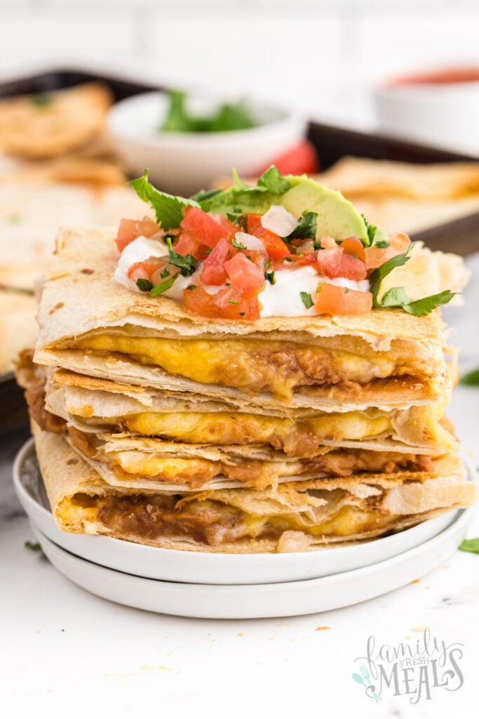 Sheet Pan Quesadillas stacked on a plate